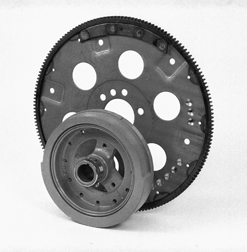 Externally balanced flywheel and harmonic balancer